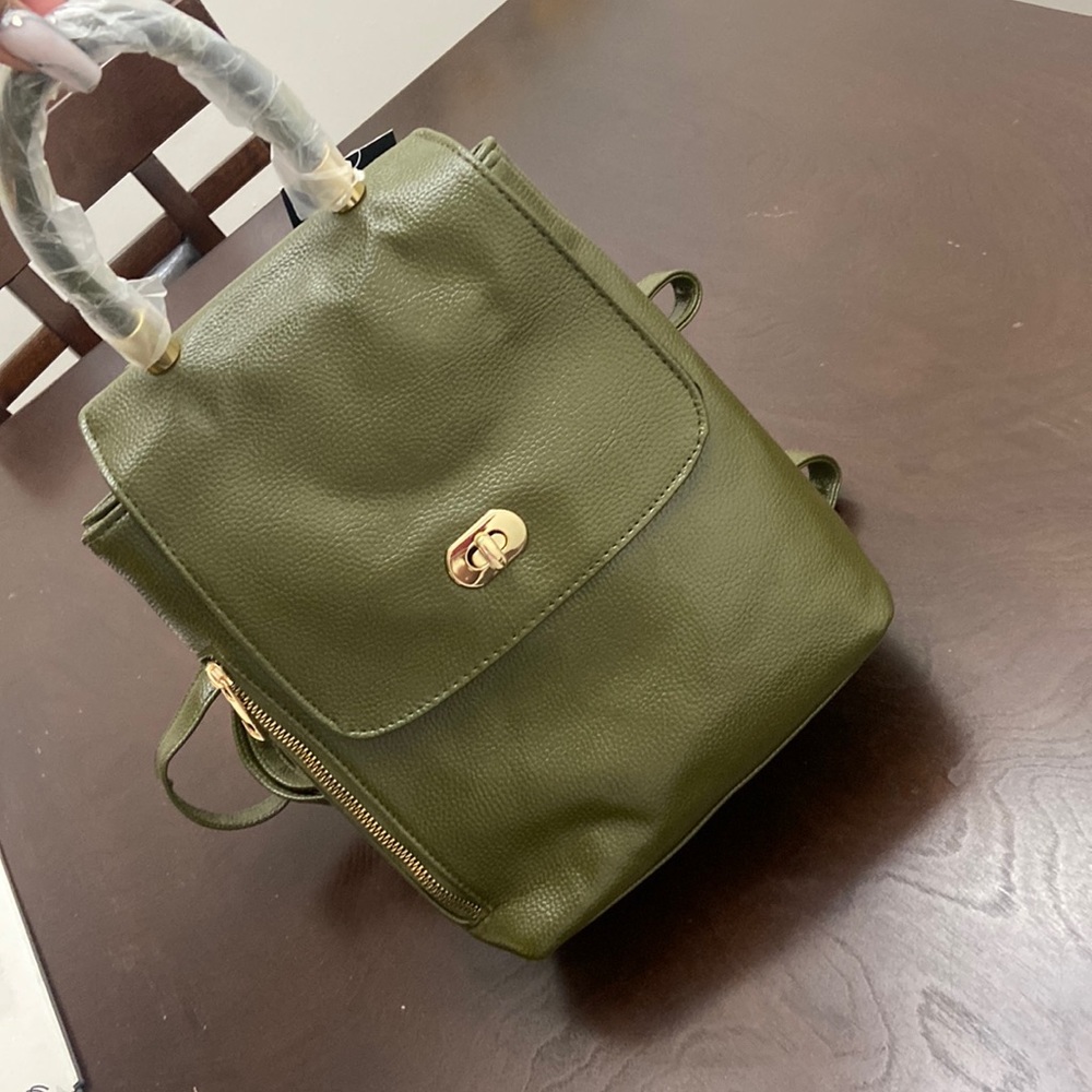 Backpack with top handle bag